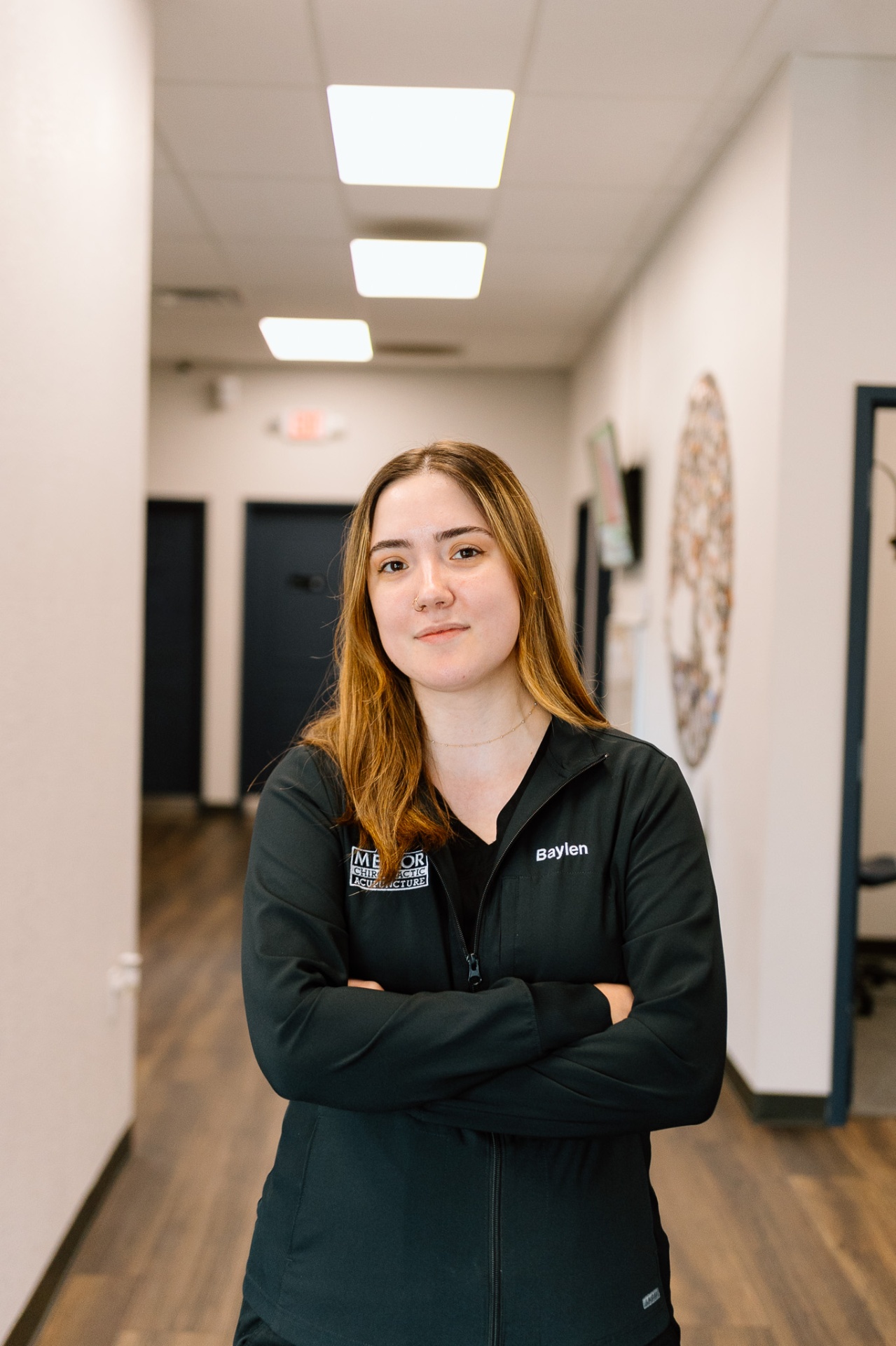 Baylen chiropractic assistant at Lenexa Meylor Chiropractic office providing patient support