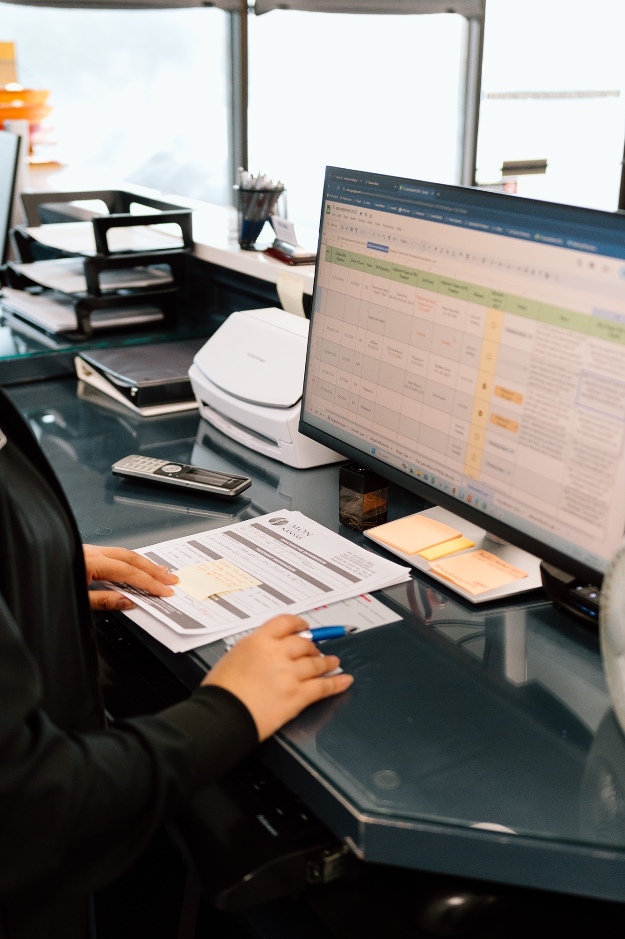 Office workspace with forms and computer