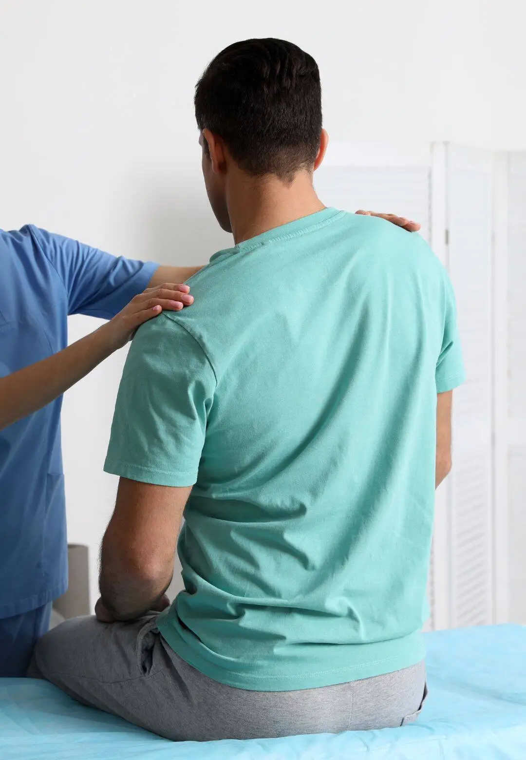 Chiropractic examination of patient's back