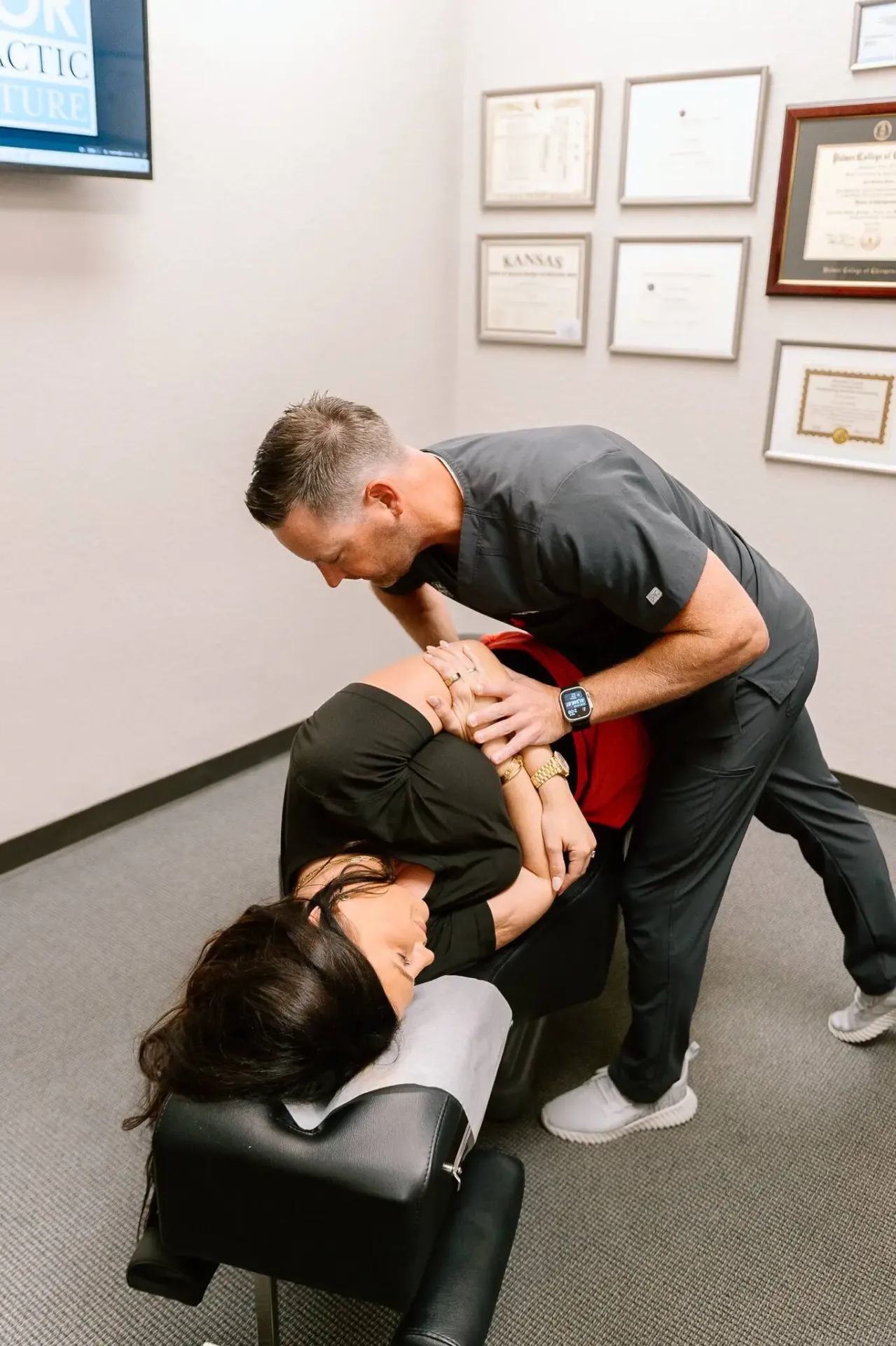 Lenexa chiropractor Dr. Meylor performing spinal adjustment for lower back pain relief
