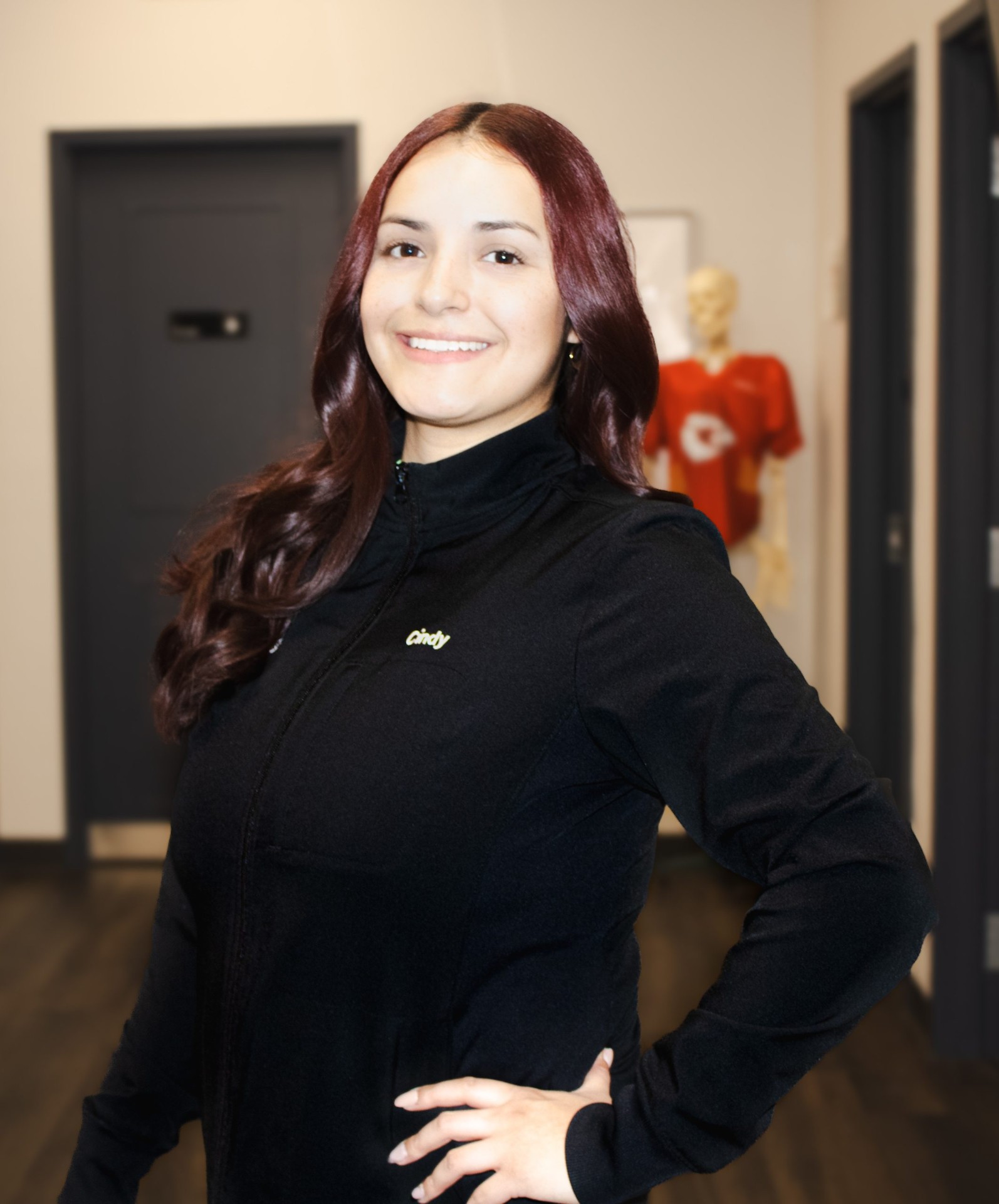 Cindy bilingual chiropractic assistant at Lenexa Meylor Chiropractic helping patients