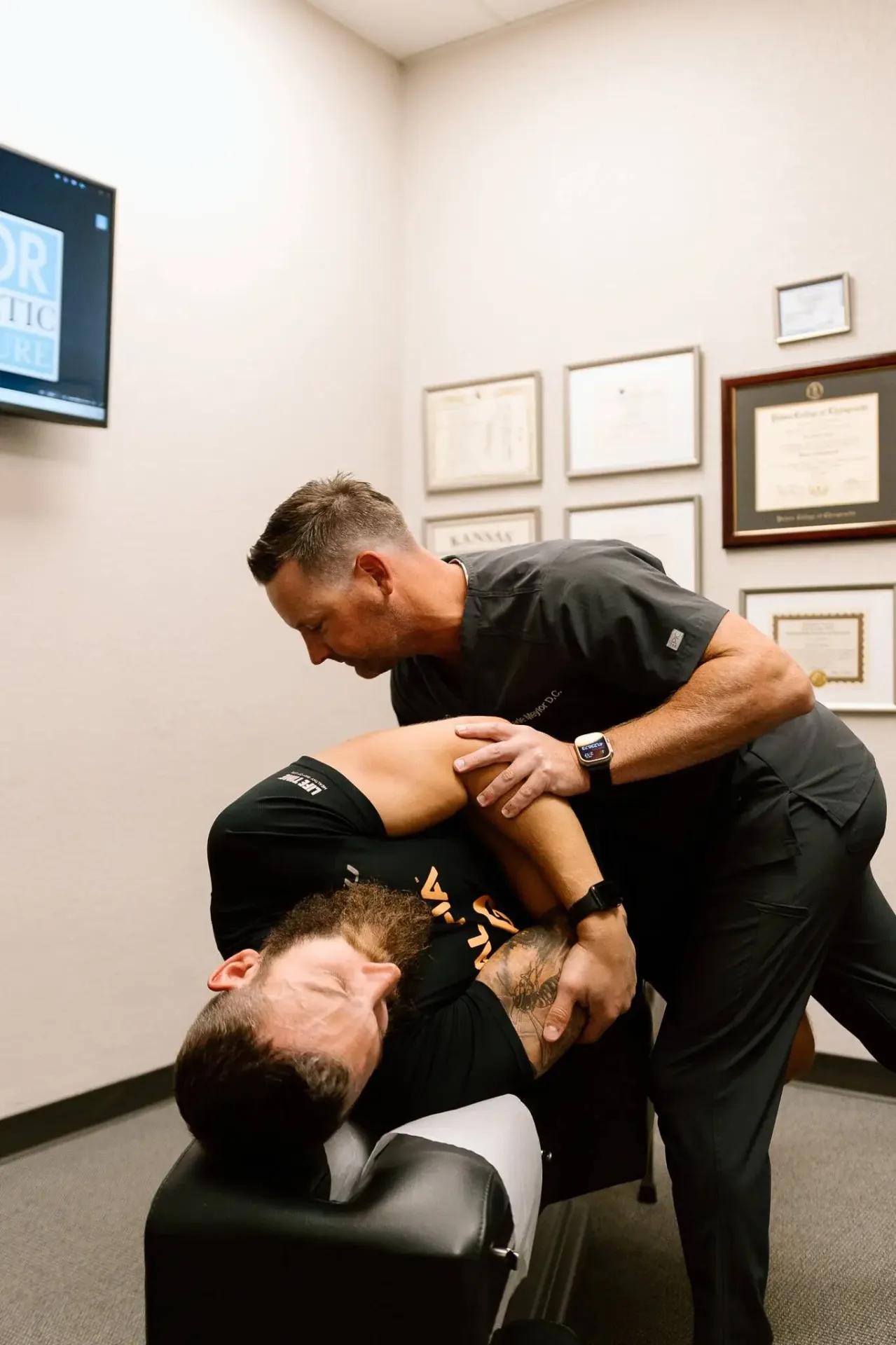Chiropractor treating patient's extremity condition